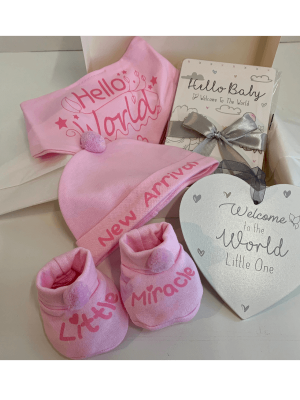 Small Pink Baby Hamper with hat, bib and booties, milestone cards and a welcome to the world wooden plaque thats all gift boxed