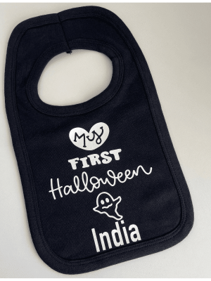Babies 1st Halloween Bib in black, with a white printed personalised halloween decal.