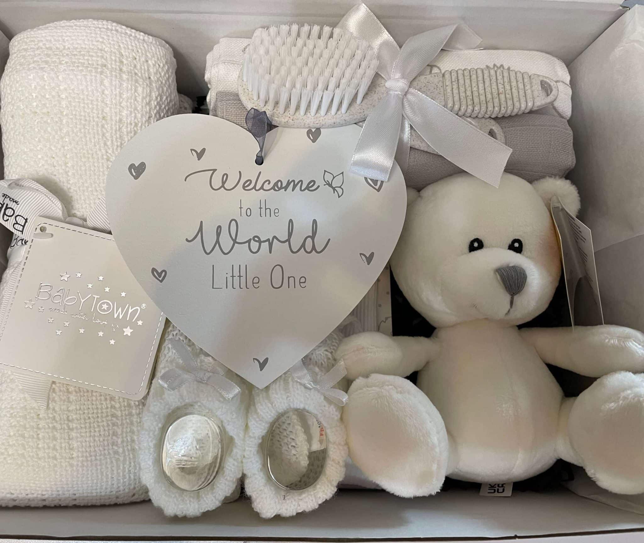 white baby gift hamper containing 12 practical newborn products, comes gift boxed