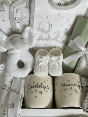 Elephant & Friends baby hamper filled with clothing, muslins, toy and mugs for parents