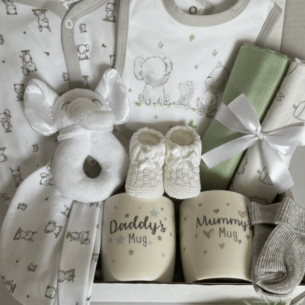 Elephant & Friends baby hamper filled with clothing, muslins, toy and mugs for parents