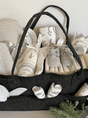 Grey Filled Nappy Caddy that has no less than 15 practical baby products all within a handy caddy basket
