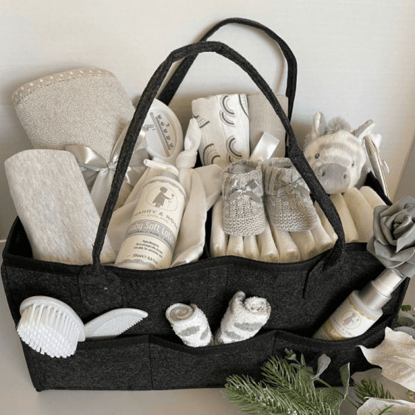 Grey Filled Nappy Caddy that has no less than 15 practical baby products all within a handy caddy basket