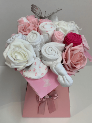 Pink Baby Clothing Bouquet that includes baby clothes made to look like a vase of flowers
