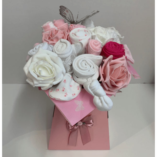 Pink Baby Clothing Bouquet that includes baby clothes made to look like a vase of flowers