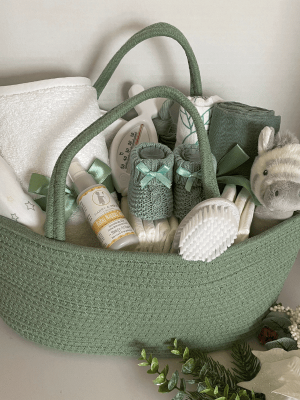Sage Filled Nappy Caddy, all your practical baby products and lotions inside a woven nappy caddy basket