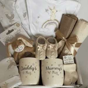 Baby Bunny gift set that includes a clothing set, bunny toy, muslin squares and a set of mugs for mummy and daddy